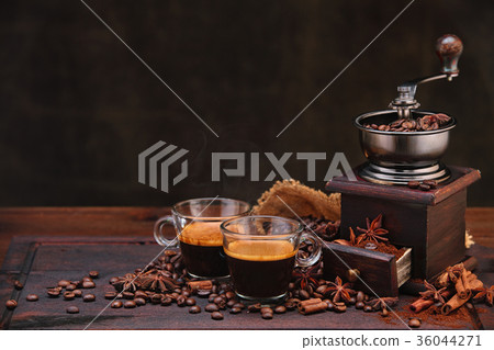Coffee beans and grinder. 36044271
