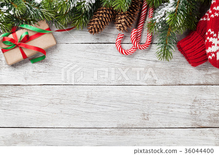 Christmas gift box, candy cane and fir tree Christmas gift box, candy cane and fir tree 36044400