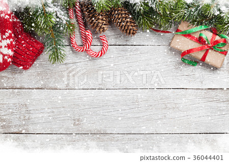 Christmas gift box, candy cane and fir tree Christmas gift box, candy cane and fir tree 36044401