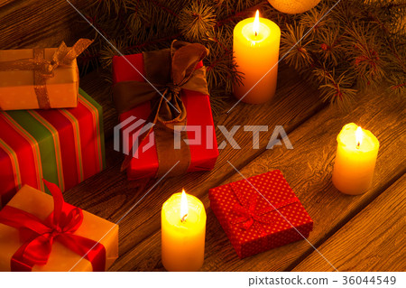 Candles, Christmas tree and gifts on wooden 36044549