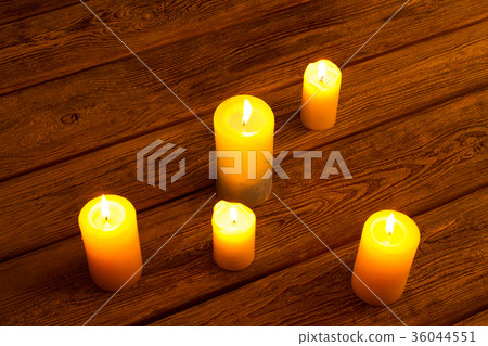 Golden light of candle flame. Golden light of candle flame. 36044551