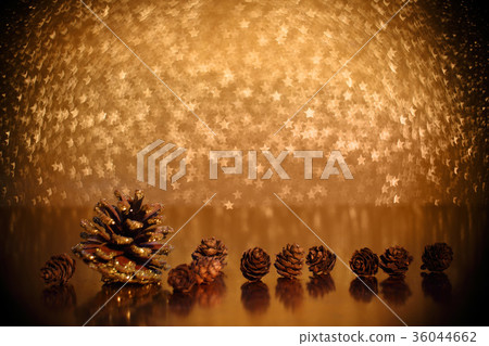 Pine cones on golden background Pine cones on golden background 36044662