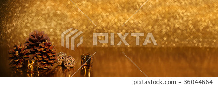 Pine cones on golden background Pine cones on golden background 36044664