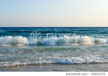View of the sea. The wave hits the sandy beach. View of the sea. The wave hits the sandy beach. 36045235