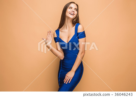 The young woman's portrait with happy emotions The young woman's portrait with happy emotions 36046243