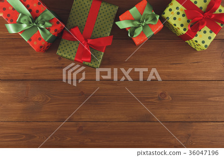 Colorful Christmas present boxes on wooden Colorful Christmas present boxes on wooden 36047196