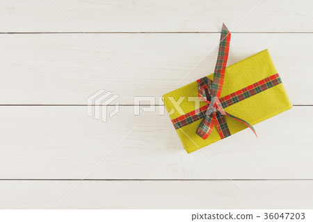 Xmas gift box on white wood table. Top view with Xmas gift box on white wood table. Top view with 36047203