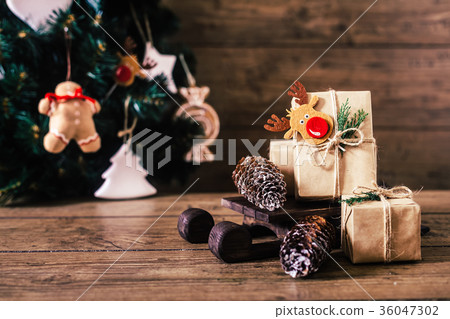 Christmas Gifts with Boxes on Wooden Background Christmas Gifts with Boxes on Wooden Background 36047302