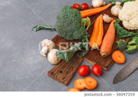 Wooden desk with fresh vegetables, copy space Wooden desk with fresh vegetables, copy space 36047359