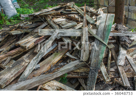 Woodpile of wooden planks. Pile of aged wood bark Woodpile of wooden planks. Pile of aged wood bark 36048753