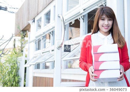 startup small business owner holding parcel box at workplace. woman seller prepare product for delivery to customers. Online selling, e-commerce, shipping concept startup small business owner holding parcel box at workplace. woman seller prepare product for delivery to customers. Online selling, e-commerce, shipping concept 36049073
