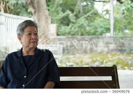 elder woman resting in garden. elderly female relaxing in park. senior leisure lifestyle outdoors. elder woman resting in garden. elderly female relaxing in park. senior leisure lifestyle outdoors. 36049076