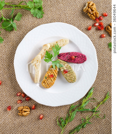 Georgian cuisine. Spinach appetizer phali with pomegranate seeds Georgian cuisine. Spinach appetizer phali with pomegranate seeds 36049644