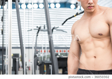 man athlete prepare for training in gym. bodybuilder male working out in fitness center. sport guy doing exercises in health club. man athlete prepare for training in gym. bodybuilder male working out in fitness center. sport guy doing exercises in health club. 36050302