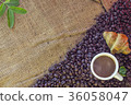 Coffee cup and Croissant on beans and sack 36058047