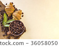 Coffee cup and Croissant on beans 36058050