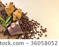 Coffee cup and Croissant on beans 36058052