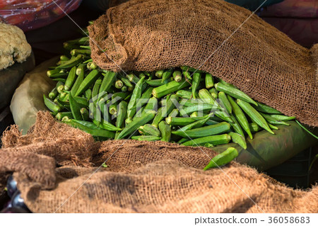 Pile of fresh okra for sale in market Pile of fresh okra for sale in market 36058683