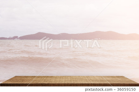 Wooden counter top with sea ocean background Wooden counter top with sea ocean background 36059150