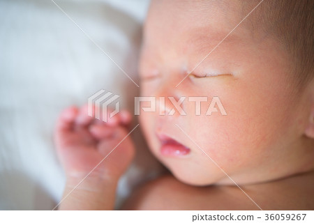 Asian new born baby is sleeping, close up 36059267