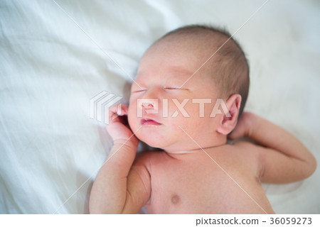 One week old newborn baby sleeping 36059273