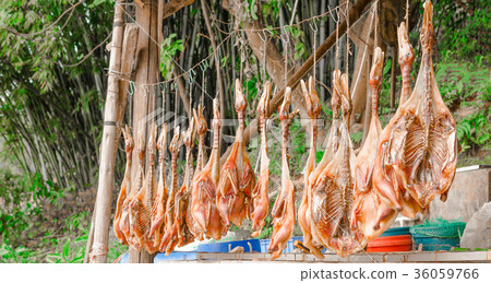 duck hanging for air dry before roasting 36059766