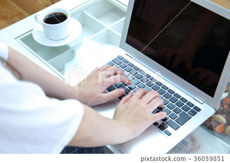 Woman using a laptop Woman using a laptop 36059851