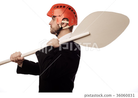 balanced businessman in a helmet and with an oar balanced businessman in a helmet and with an oar 36060831