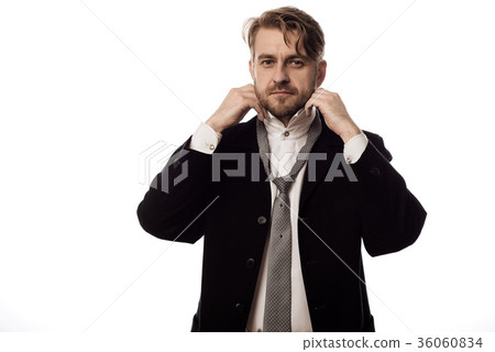young stylish businessman dresses at work young stylish businessman dresses at work 36060834