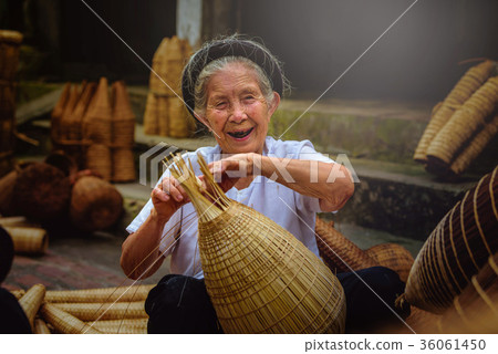 Vietnamese fishermen are doing basketry 36061450