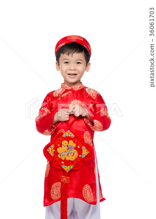 Vietnamese boy cuddling stuffed carp 36061703