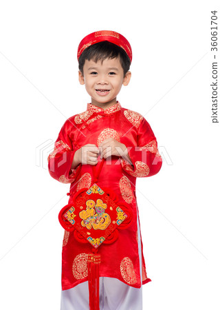 Vietnamese boy cuddling stuffed carp 36061704