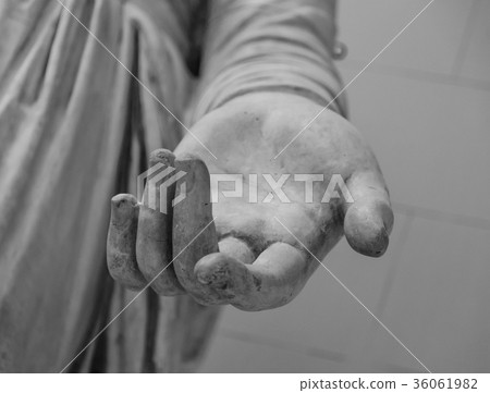 stone statue detail of human hand 36061982