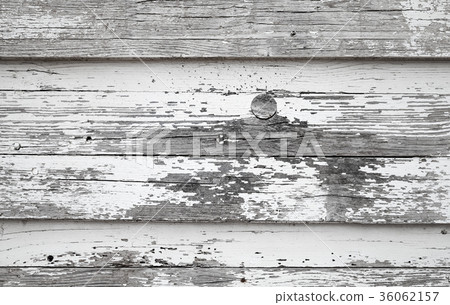 Old wooden wall with peeling white paint 36062157