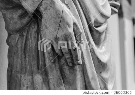 stone statue detail of human hand 36063305