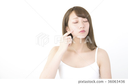 Woman closing eyes her finger on cheek Woman closing eyes her finger on cheek 36063436