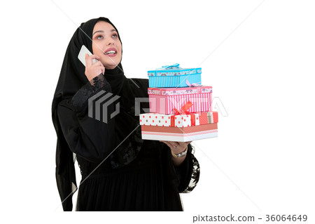 Happy young muslim woman with shopping bag and 36064649