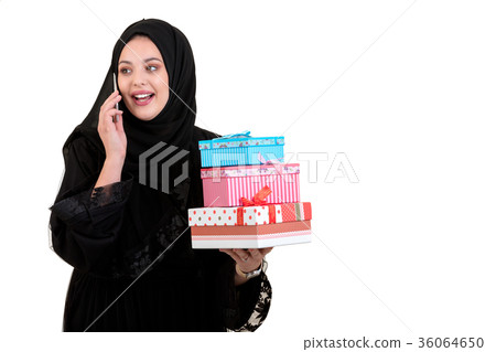 Happy young muslim woman with shopping bag and Happy young muslim woman with shopping bag and 36064650