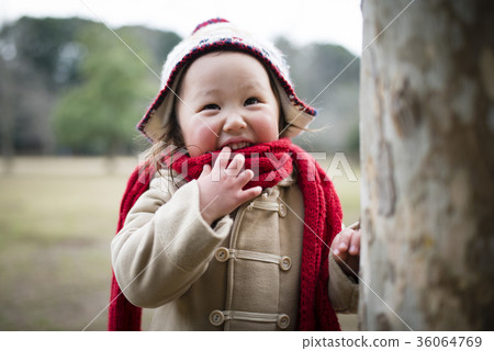 A girl playing in a park in winter 36064769