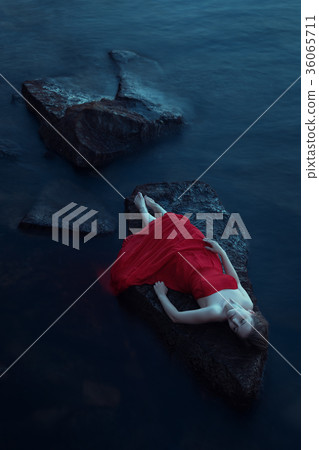 Lonely woman near the sea Lonely woman near the sea 36065711