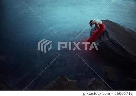 Lonely woman near the sea Lonely woman near the sea 36065712