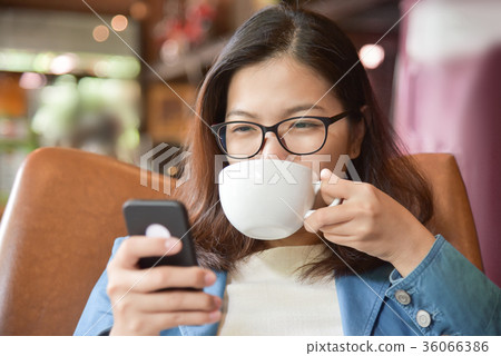 Woman drinking hot of coffee. Woman drinking hot of coffee. 36066386