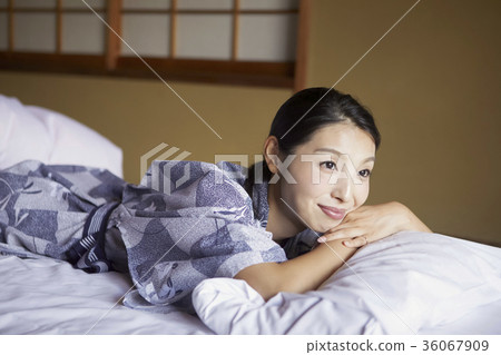 Woman relaxing at the inn 36067909