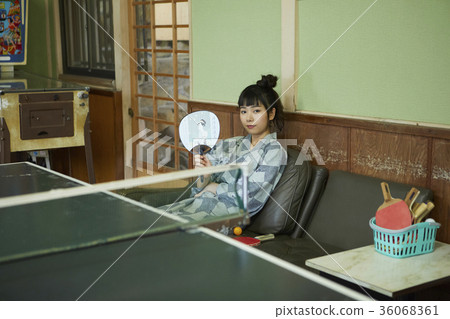 Woman in a hot spring entertainment room Woman in a hot spring entertainment room 36068361