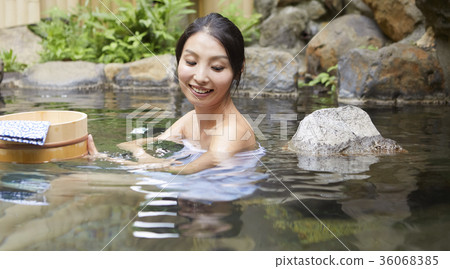 A woman taking an open-air bath A woman taking an open-air bath 36068385
