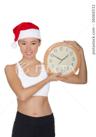happy asian women in a Santa's hat with a clock 36068532