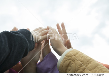 Children putting their hands together 36068949