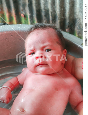 newborn child boy having his bath 36069932