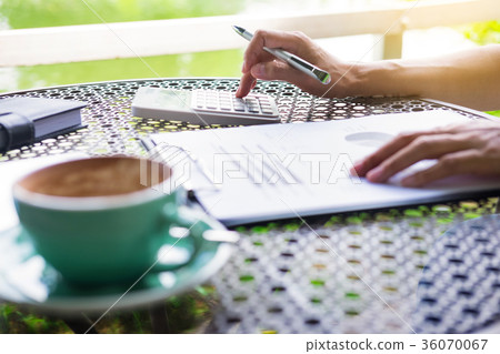 Business women working by using calculator for process financial Business women working by using calculator for process financial 36070067