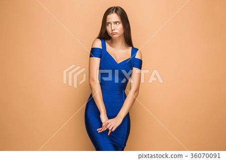 The young woman's portrait with sad emotions The young woman's portrait with sad emotions 36070091